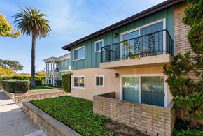 Santa Barbara apartment for rent - the front of a house with a palm tree next to it