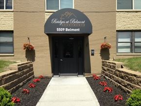 Cincinnati apartment for rent - the front entrance of a building with a blue awning
