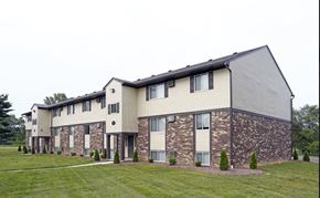 Toledo apartment for rent - an apartment building with stone and wood siding