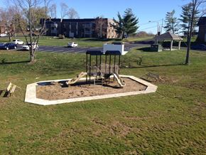 Erlanger apartment for rent - a playground in a park with a swing set