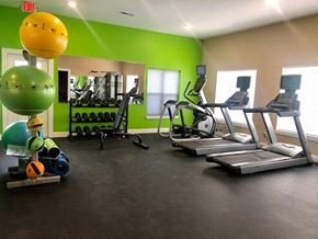 Carlisle apartment for rent - a gym with weights and other exercise equipment
