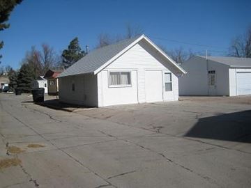 Kearney apartment for rent - a small white house sitting in a parking lot