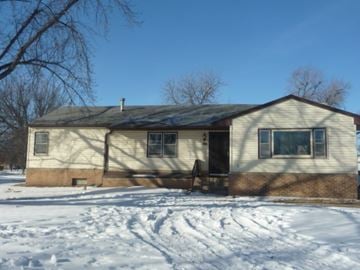 Kearney apartment for rent - a house in the snow with the front door open