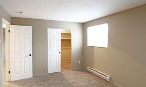 Milford apartment for rent - an empty living room with two doors and a window