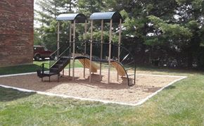 Milford apartment for rent - a playground in a yard with a swing set