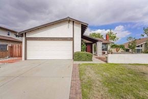 Rancho Cucamonga house for rent - A house with a white garage door is shown.
