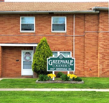 South Euclid apartment for rent - a greenvale landlord sign in front of a brick building