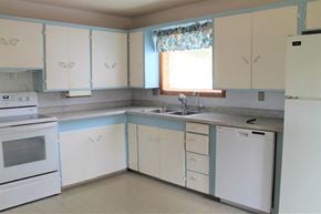 Brandon house for rent - an empty kitchen with white appliances and white cabinets