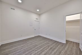 Philadelphia apartment for rent - an empty living room with white walls and a door to a closet