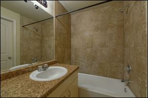 El Paso apartment for rent - a bathroom with a sink and a tub and a shower