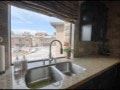 El Paso apartment for rent - A kitchen sink with a window overlooking a street.