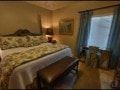 El Paso apartment for rent - A bedroom with a bed, a chair, and a window.