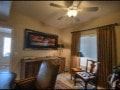 El Paso apartment for rent - A living room with a brown leather couch and a painting on the wall.