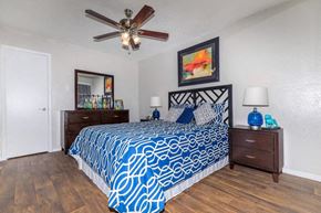 Dallas apartment for rent - A bedroom with a blue and white patterned bedspread.