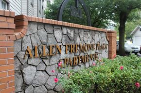 Portland apartment for rent - a stone wall with a sign that says allen bremont parkidy