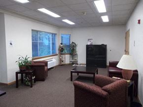 Portland apartment for rent - a living room with couches a table and a television