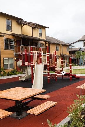 Vancouver apartment for rent - a playground is shown in front of an apartment building