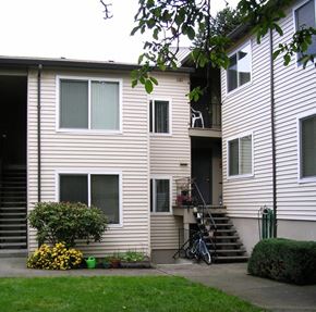 Portland apartment for rent - A two-story house with a bicycle leaning against the wall.