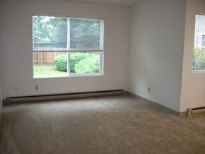 Portland apartment for rent - A room with a window and a carpeted floor.