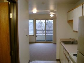 Portland apartment for rent - an empty kitchen with a view of a living room