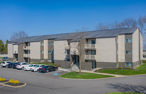 Brunswick apartment for rent - A parking lot in front of a building with cars parked.
