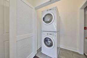 Philadelphia apartment for rent - a front loading washer and dryer in a laundry room