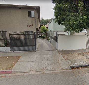 Los Angeles apartment for rent - A house numbered 5042 is seen with a black gate.