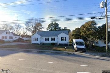 Rolesville apartment for rent - a van parked in front of a white house