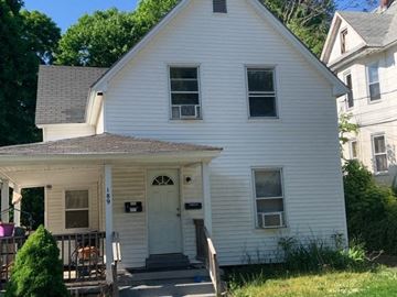 Manchester apartment for rent - a white house with a white door and a porch