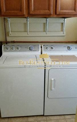 Minneapolis apartment for rent - A white dishwasher and stove top oven in a kitchen.