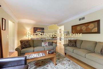 Minneapolis house for rent - a living room with couches and a coffee table