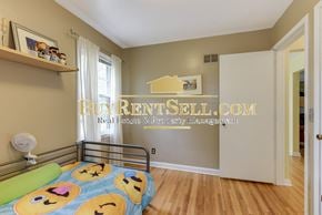Minneapolis house for rent - a bedroom with a bed and a mirror in a small room