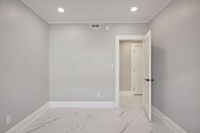 Minneapolis apartment for rent - A room with a marble floor and a door.