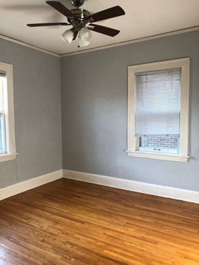 Minneapolis apartment for rent - an empty room with a ceiling fan and a window
