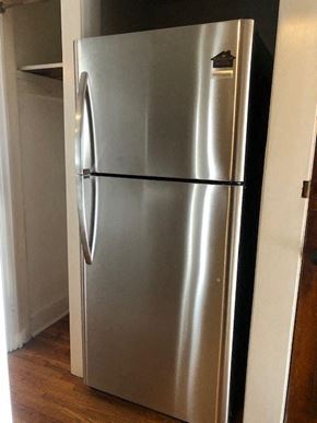 Minneapolis apartment for rent - a stainless steel refrigerator in the corner of a room