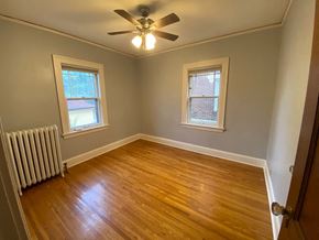 Minneapolis apartment for rent - a living room with wood floors and a ceiling fan