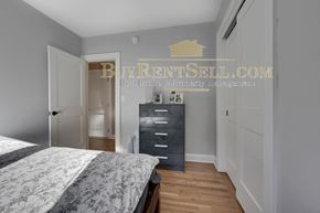 Minneapolis apartment for rent - a bedroom with a bed and a dresser