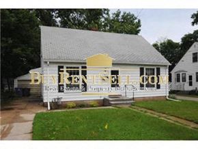 Minneapolis house for rent - A white house with a sign that says BuyKentSell.com in front of it.