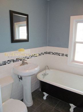Minneapolis apartment for rent - a bathroom with a sink and a bath tub