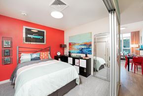 San Jose apartment for rent - One Bedroom Apartments in Downtown San Jose, CA - One South Market Bedroom with Carpet Flooring and Modern Lighting