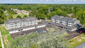 Grand Rapids apartment for rent - an aerial view of an apartment complex surrounded by trees