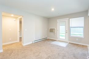 Grand Rapids apartment for rent - an empty living room with a door and a window