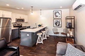 Lantz apartment for rent - an open kitchen and living room with an island and stools