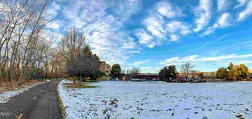 Boise apartment for rent - a snow covered field next to a road