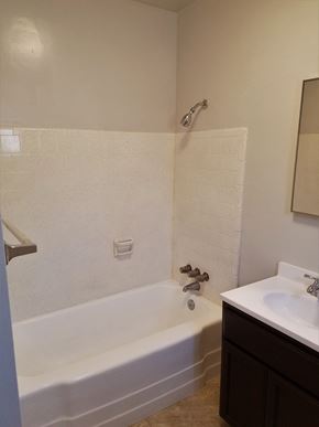 San Bernardino apartment for rent - an empty bathroom with a tub and a sink