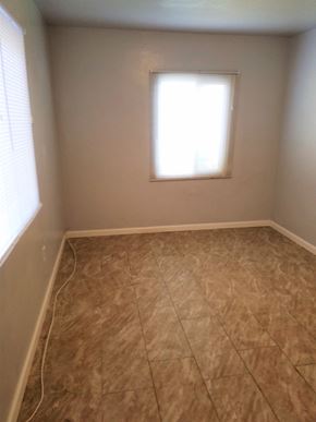 San Bernardino apartment for rent - an empty room with tiled floors and a window