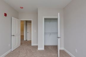 Derry apartment for rent - a bedroom with a closet and an open door