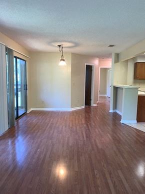 Niceville house for rent - A room with wooden flooring and a ceiling light.