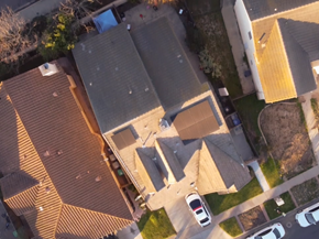 Santa Maria apartment for rent - A bird's eye view of a residential area with houses and cars.