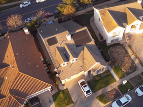 Santa Maria apartment for rent - A bird's eye view of a residential area with houses and cars.